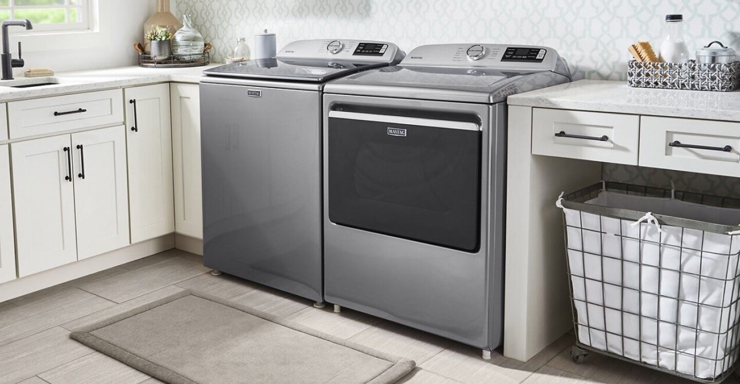 Gray Maytag® washer and dryer pair in white cabinetry Gray Maytag® washer and dryer pair in white cabinetry